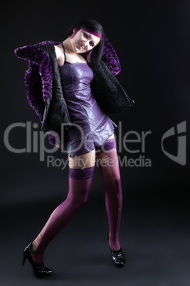 Young girl in purple fur coat and gothic make-up