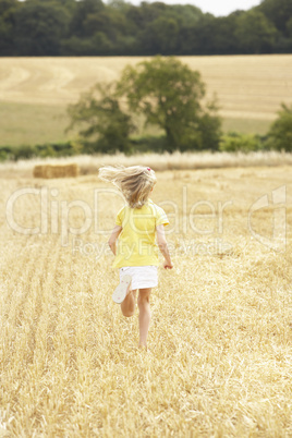 Girl Running Through Summer Harvested Field