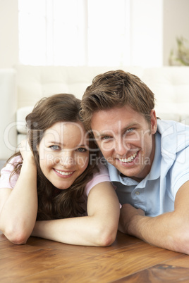 Affectionate Couple Relaxing At Home Together