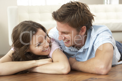 Affectionate Couple Relaxing At Home Together