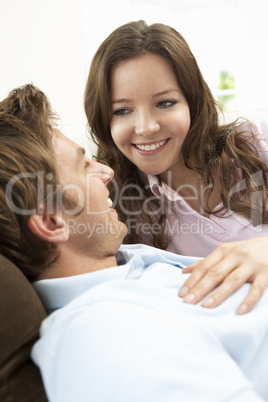 Affectionate Couple Relaxing At Home Together