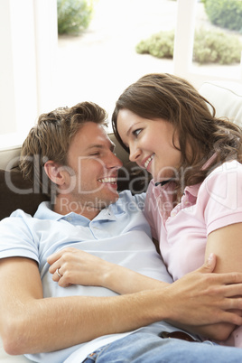 Affectionate Couple Relaxing At Home Together