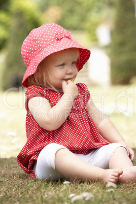 Young Girl Playing In Garden At Home
