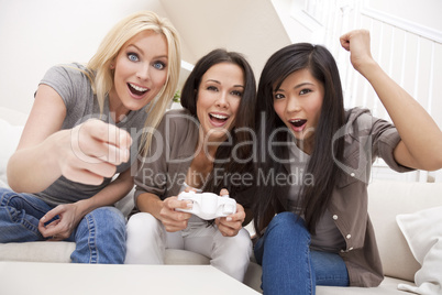 Three Beautiful Women Friends Playing Computer Games at Home