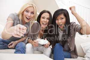 Three Beautiful Women Friends Playing Computer Games at Home