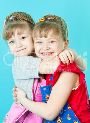 Twin sisters hugging