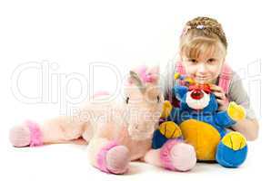 Girl surrounded by her toys