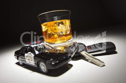 Highway Patrol Police Car Next to Alcoholic Drink and Keys