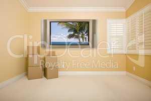 Flat Panel Television on Wall in Empty Room with Boxes