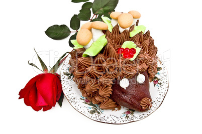 Cake in the form of a hedgehog with a rose