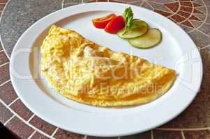 Omelette with tomatoes and cucumbers