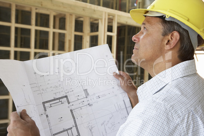 Architect With Plans In New Home