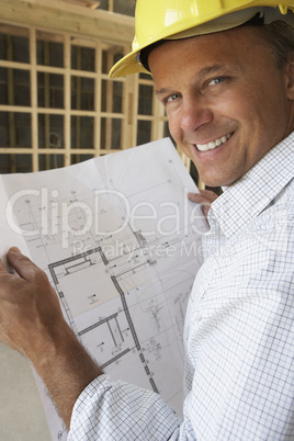 Architect With Plans In New Home