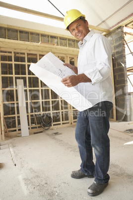 Architect With Plans In New Home