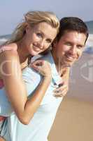 Young Couple Enjoying Beach Holiday