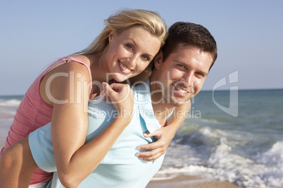 Young Couple Enjoying Beach Holiday