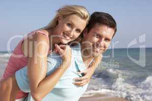 Young Couple Enjoying Beach Holiday