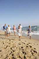 Portrait Of Three Generation Family On Beach Holiday