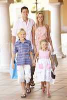 Young Family Enjoying Shopping Trip Together