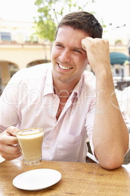 Young Man Enjoying Cup Of Coffee In Caf?