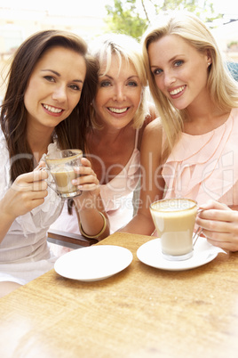 Three Women Enjoying Cup Of Coffee In Caf?
