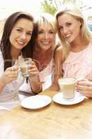 Three Women Enjoying Cup Of Coffee In Caf?
