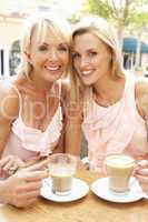 Two Women Enjoying Cup Of Coffee In Caf?