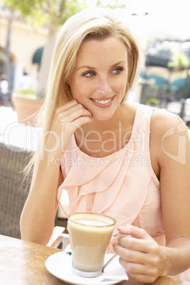 Young Woman Enjoying Cup Of Coffee In Caf?