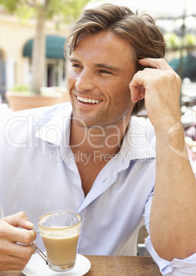 Young Man Enjoying Cup Of Coffee In Caf?