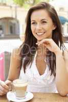 Young Woman Enjoying Cup Of Coffee In Caf?