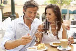 Young Couple Enjoying Coffee And Cake In Caf?