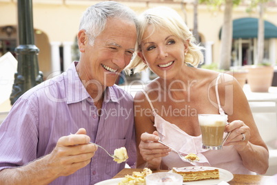 Senior Couple Enjoying Coffee And Cake In Caf?
