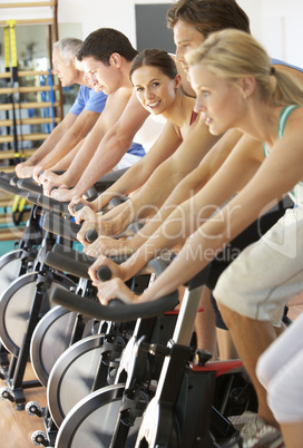 Woman Cycling In Spinning Class In Gym
