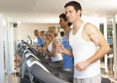 Man On Running Machine In Gym