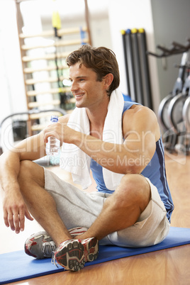 Man Resting After Exercises In Gym