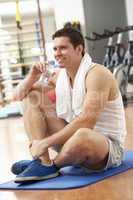 Man Resting After Exercises In Gym