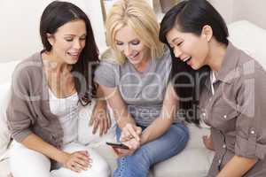 Three Beautiful Women Friends Using Smart Phone