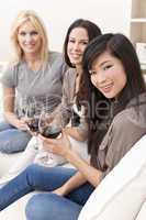Interracial Group Three Women Friends Drinking Wine Together at