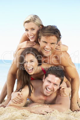 Group Of Friends Enjoying Beach Holiday