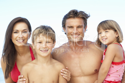 Portrait Of Family On Summer Beach Holiday