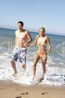 Young Couple Enjoying Beach Holiday