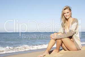 Young Woman Relaxing On Beach