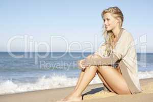 Young Woman Relaxing On Beach