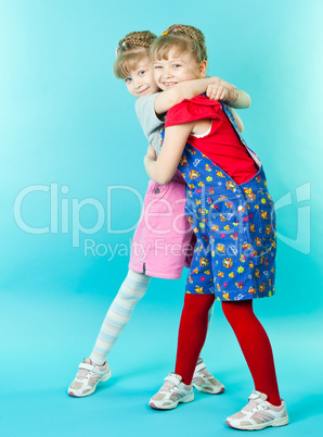 Twin sisters hugging