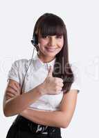 Beauty girl with headset thumbs up