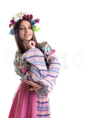 Beauty girl with garland posing in russian costume
