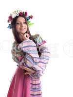 Beauty girl with garland posing in russian costume