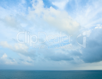 Cloudy blue sky and turquoise ocean