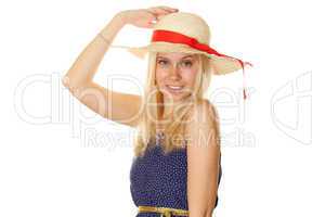 Beautiful young blond woman in a straw hat