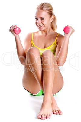 pink dumbbells in the hands of women